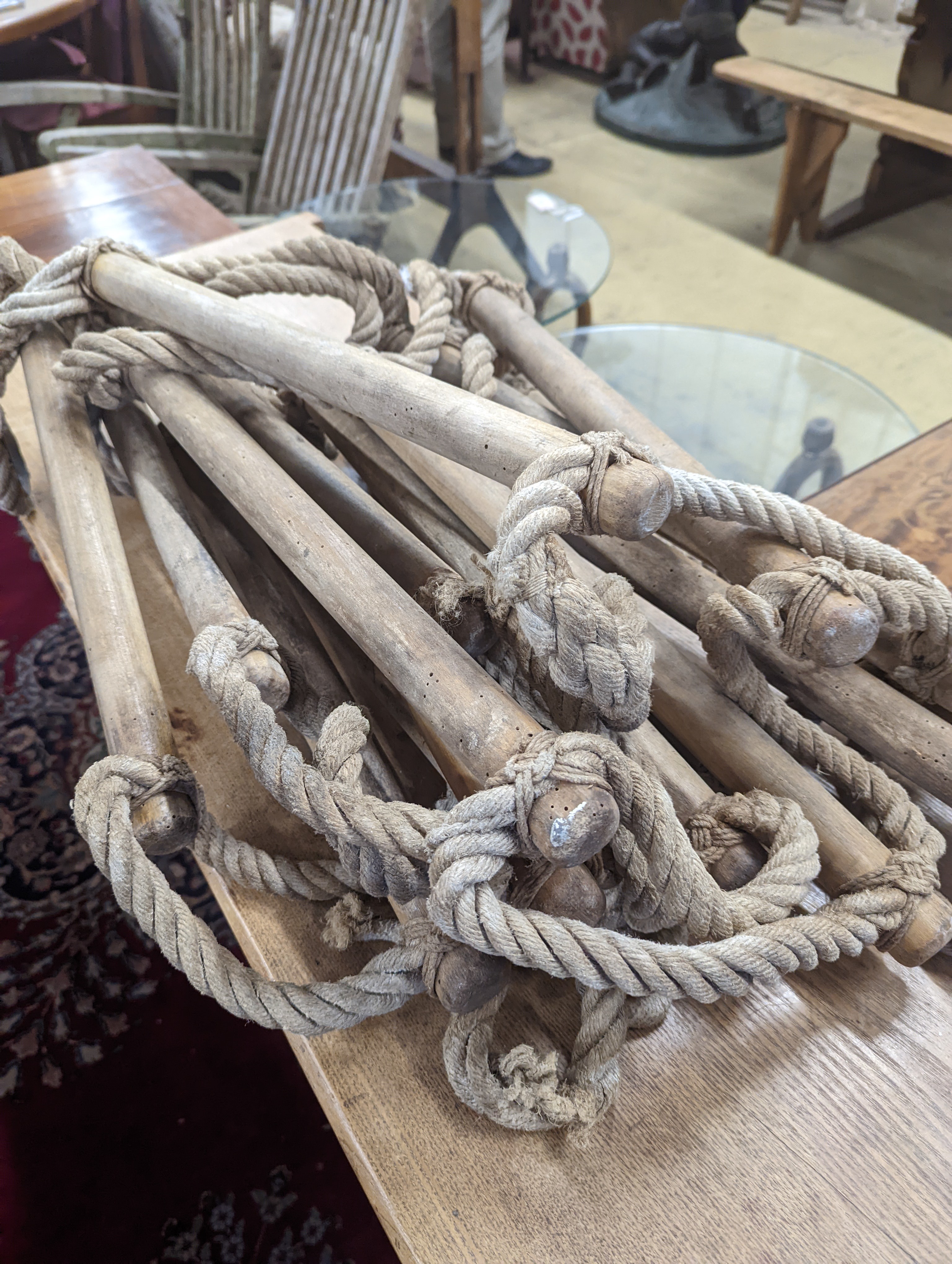 A rope ladder, Length 3.9 meters. (1 lower rung damaged)